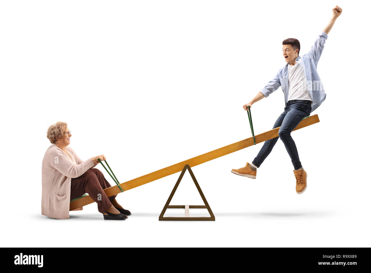 Grandmother and her teenage grandson on a seesaw isolated on white background Stock Photo