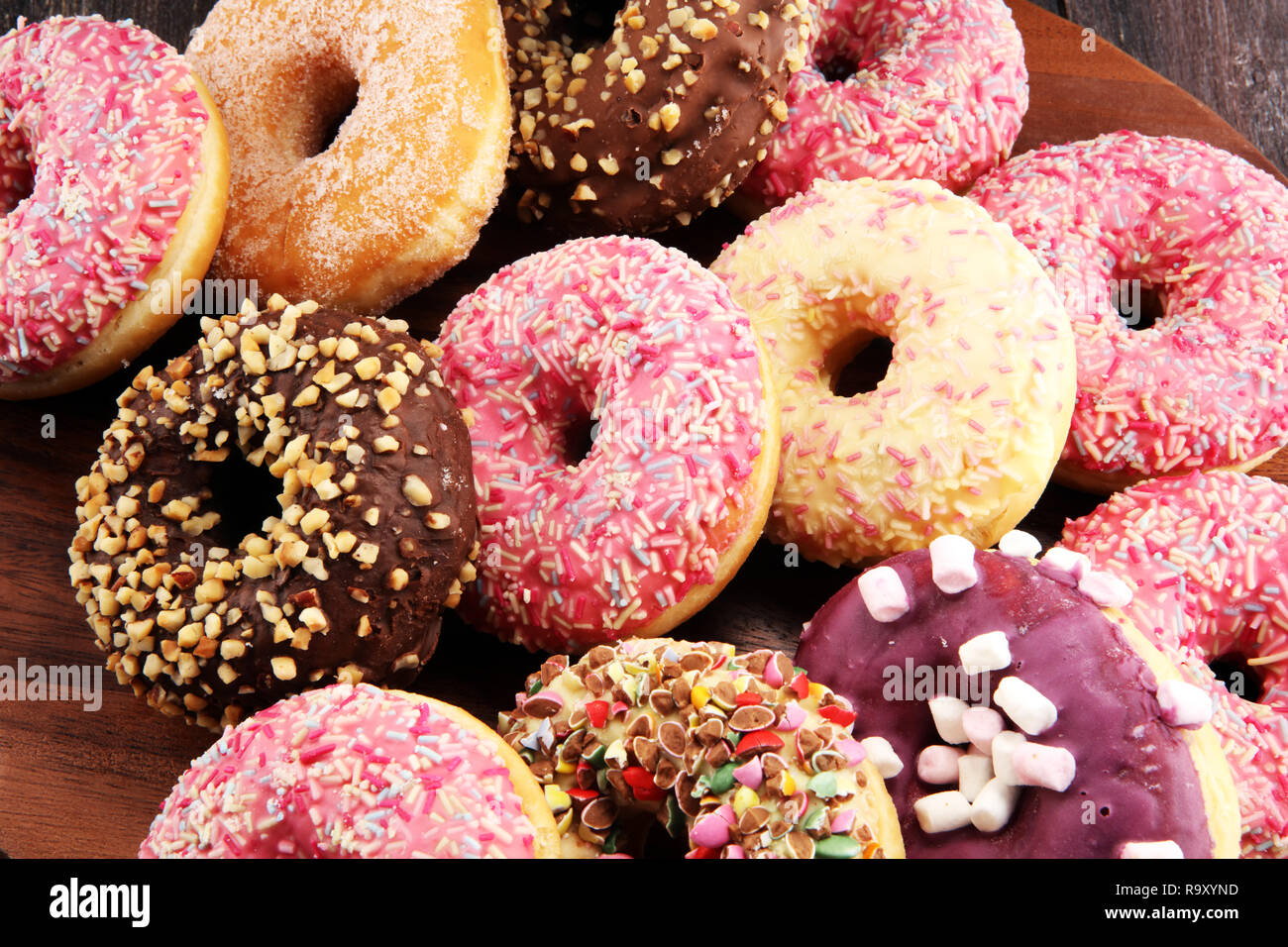 assorted donuts with chocolate frosted, pink glazed and sprinkles ...