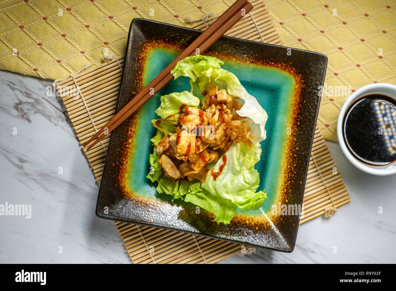 Korean Spicy Chicken Lettuce Wrap With Gochujang Sauce Served On