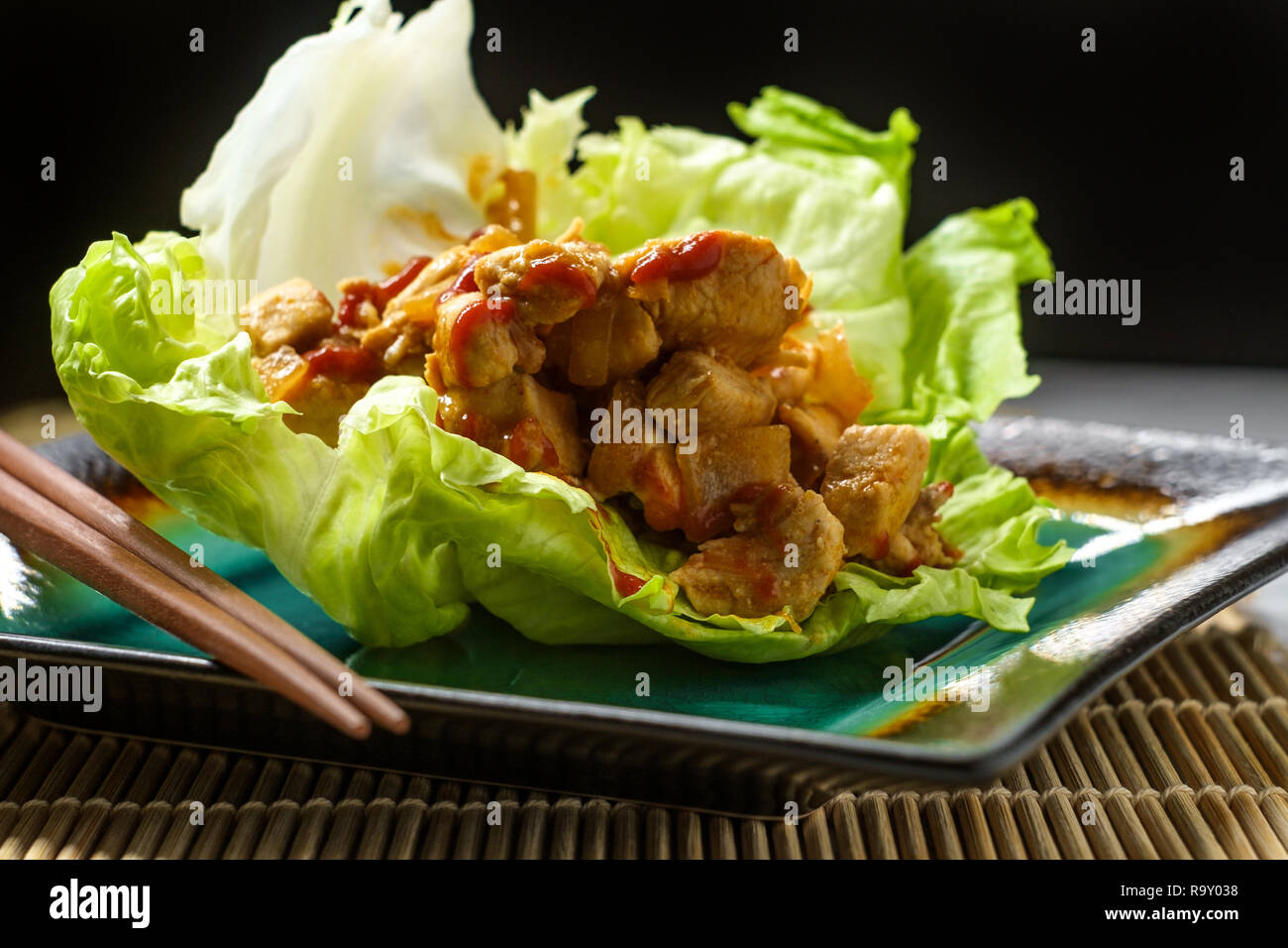 Korean Spicy Chicken Lettuce Wrap With Gochujang Sauce Served On