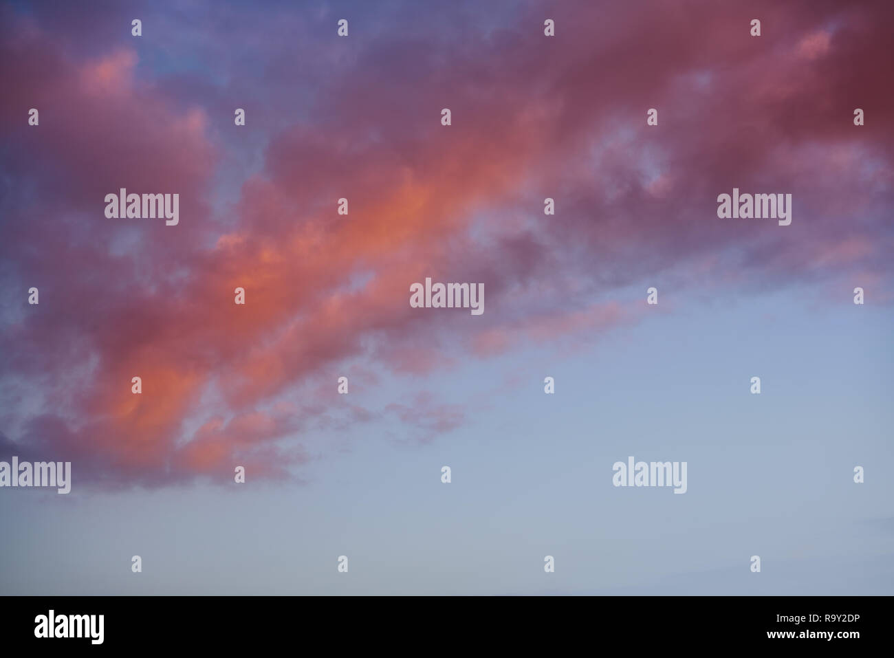 Sunset sky clouds orange and blue colors Stock Photo - Alamy