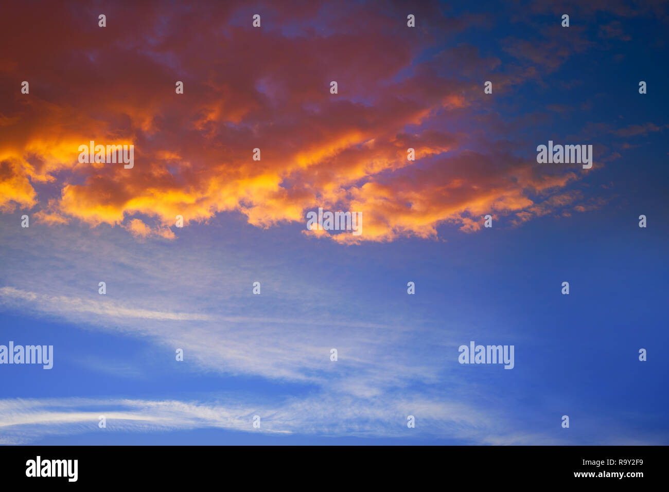 Sunset sky clouds orange and blue colors Stock Photo