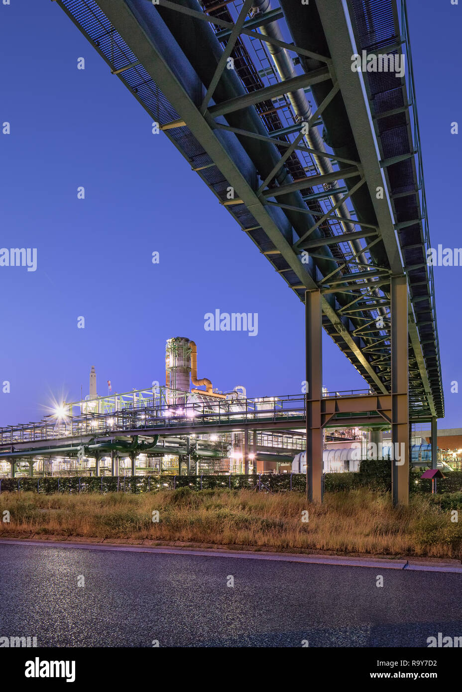 Illuminated petrochemical production plant at twilight, Port of Antwerp