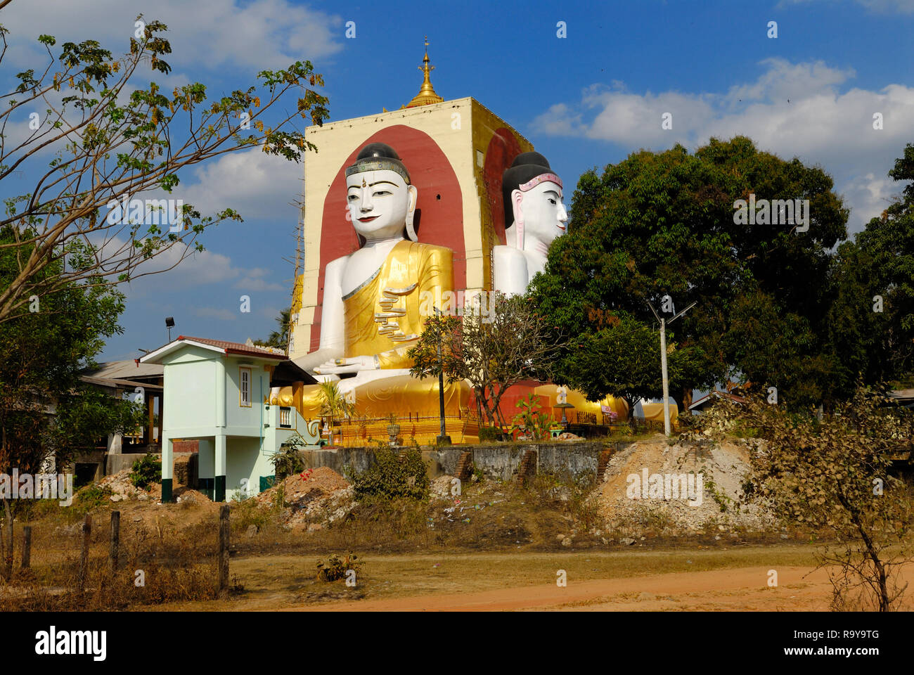 Buddha figure at the Kyaikpun Pagoda, four sitting Buddhas 30 metres high looking in four points of the compass Stock Photo