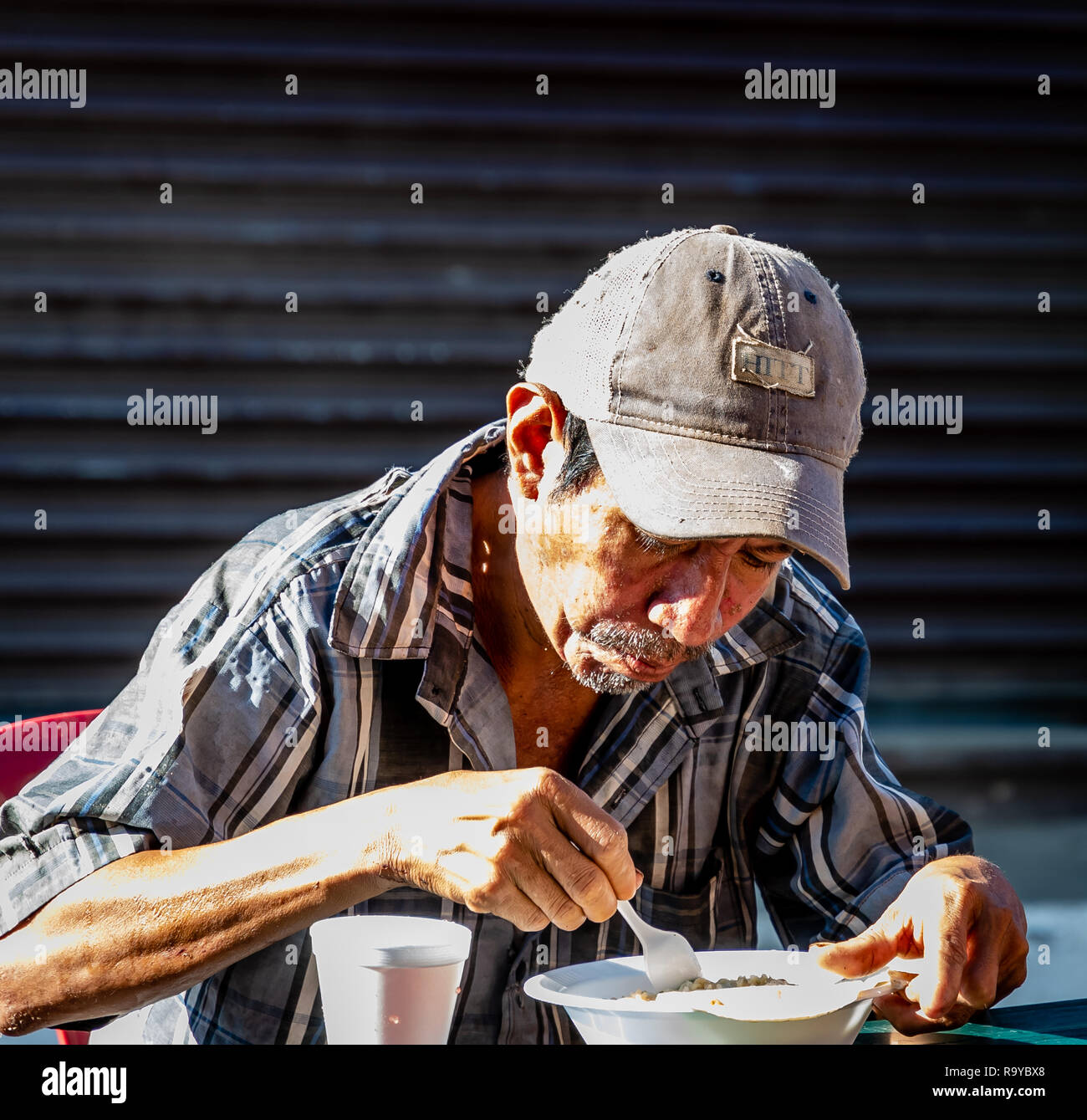 Homeless man eating hires stock photography and images Alamy