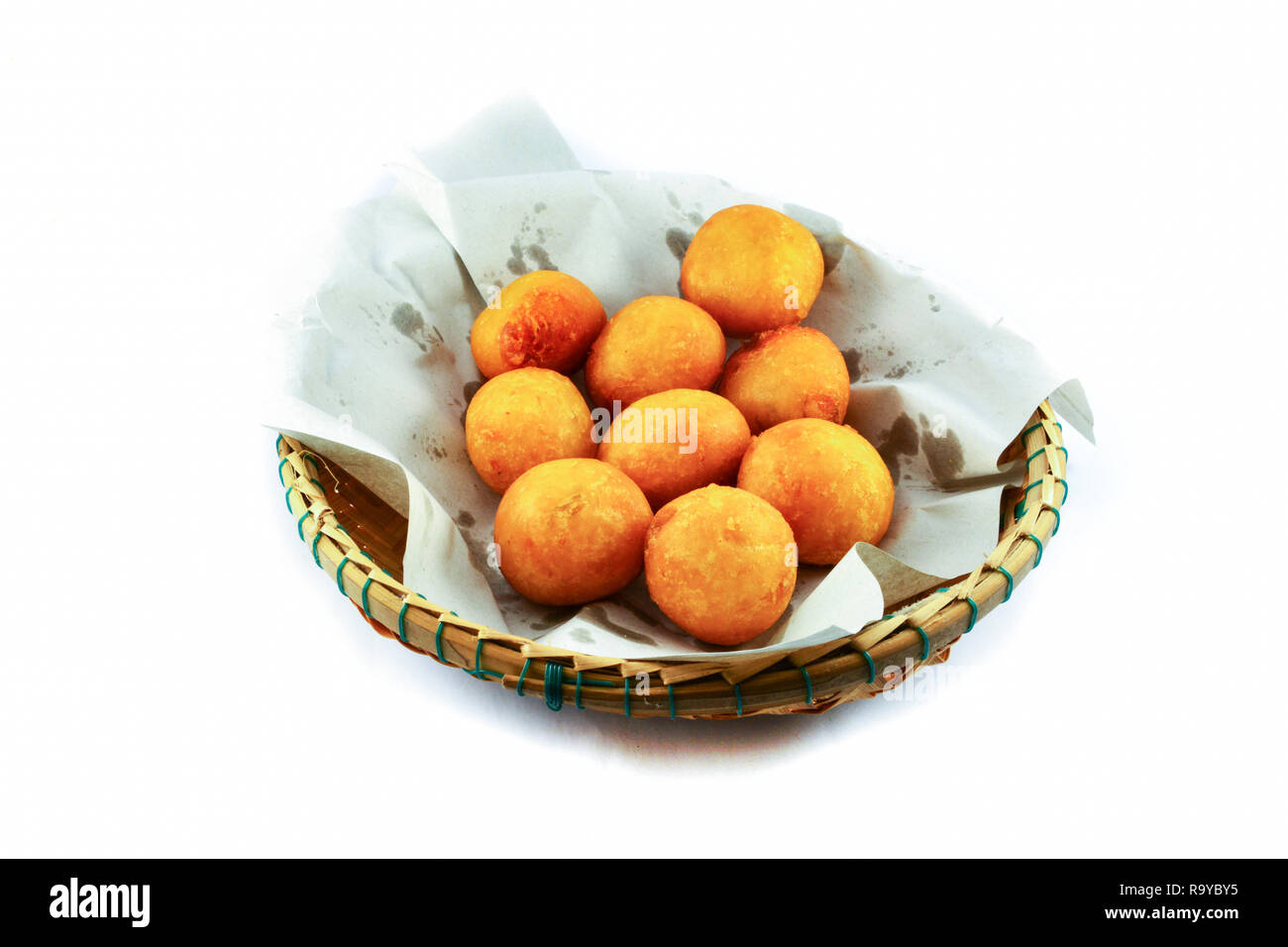 Thai Fried Sweet Potato Balls / general desserts for Snack in basket on white background Stock