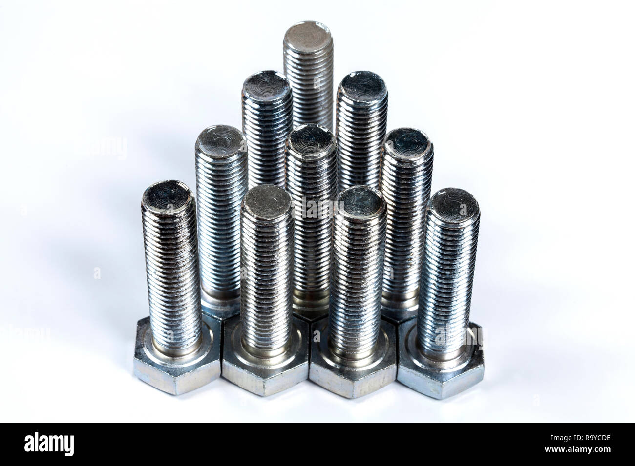 metal screw or bolt and nuts isolated on white background Stock Photo