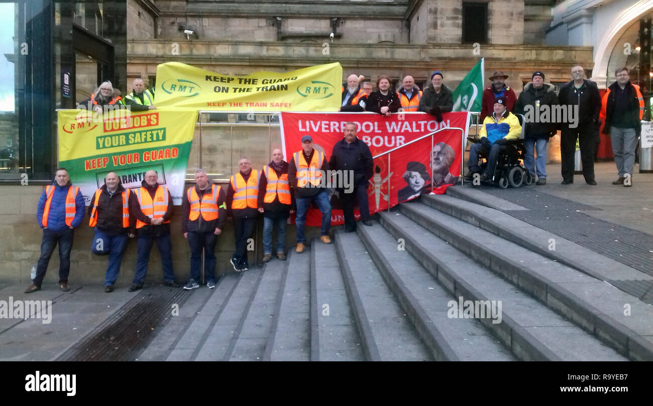 Members of the RMT union man a picket line at Liverpool Lime Street ...