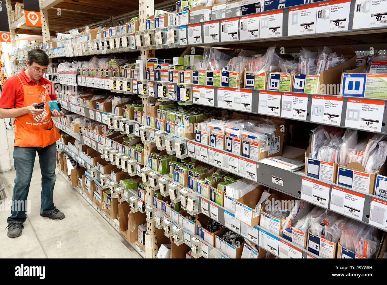 Miami Florida,The Home Depot,inside interior,hardware big box store,do it yourself,outlet switch nylon plates sale display shelves,man men male,employ Stock Photo