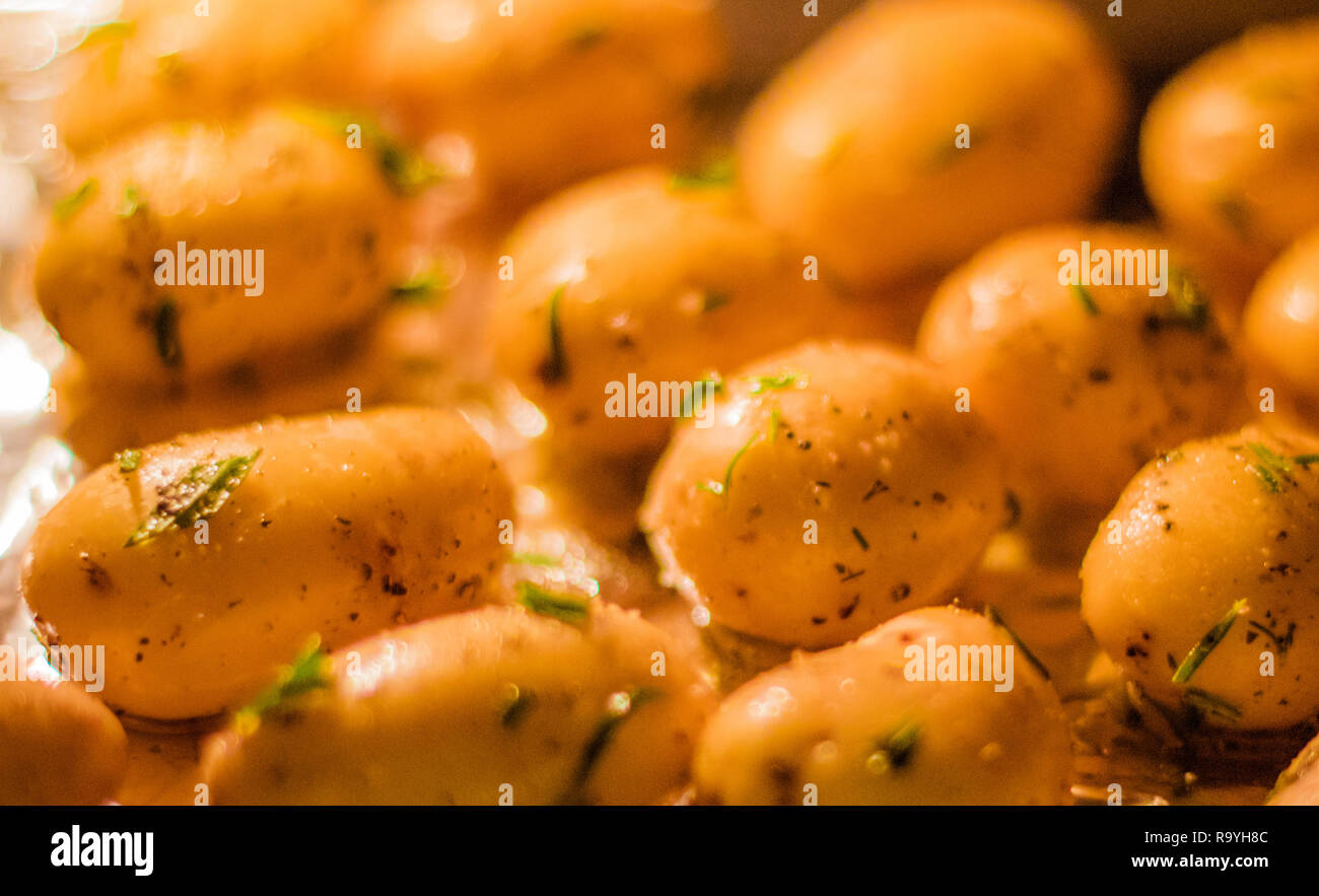 rustic food and homemade cooking styled concept - roasted potatoes in ...
