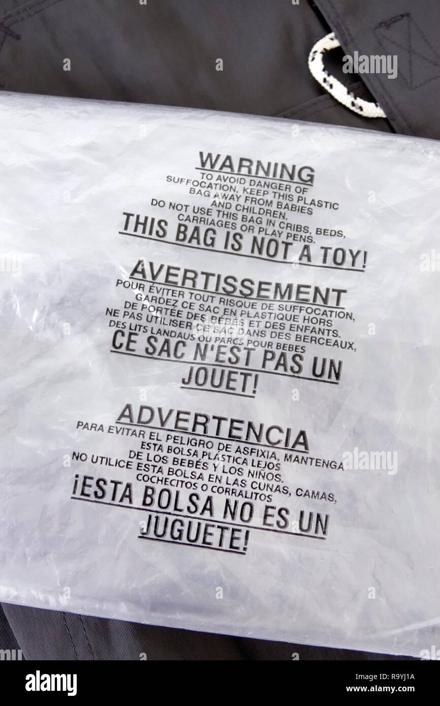 Miami Beach Florida,warning plastic bag,avoid danger suffocation,multiple languages English French Spanish,FL181222187 Stock Photo