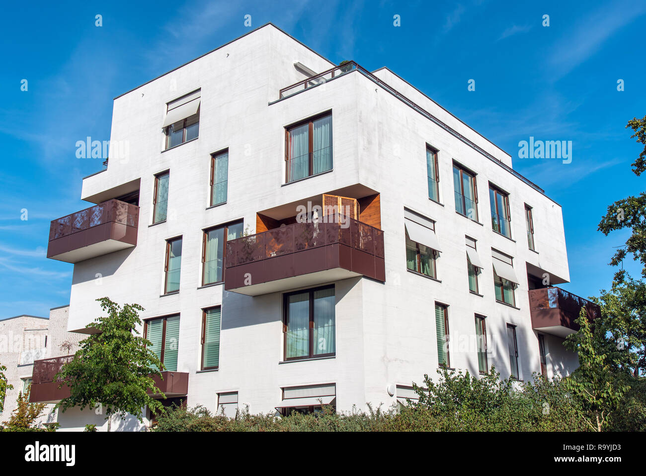 Modern white apartment house with metal balconies seen in Berlin ...