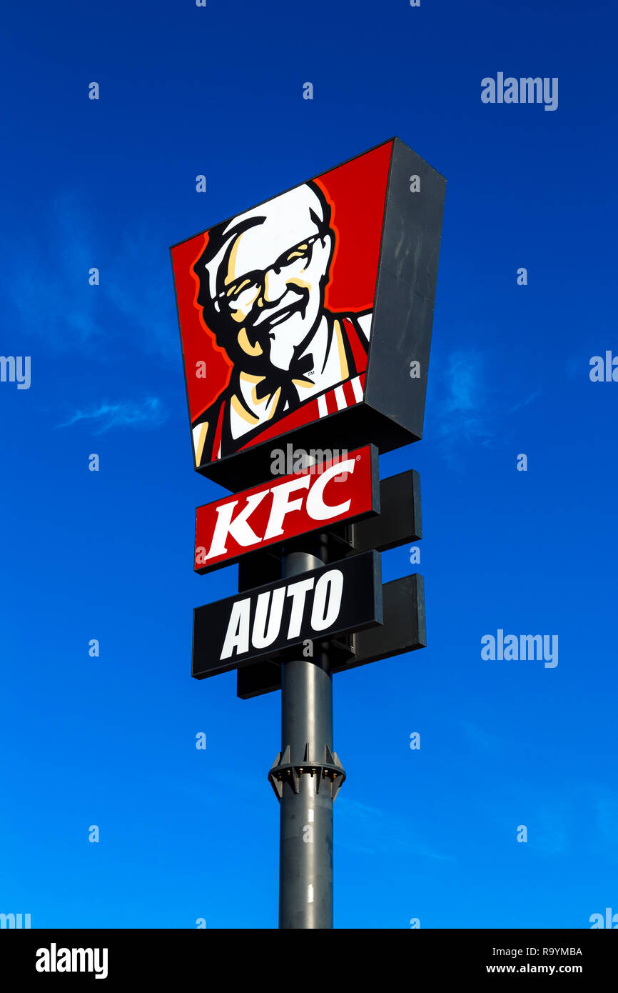 Sign for KFC drive thru against blue sky (Castellon de la Plana, Spain) Stock Photo