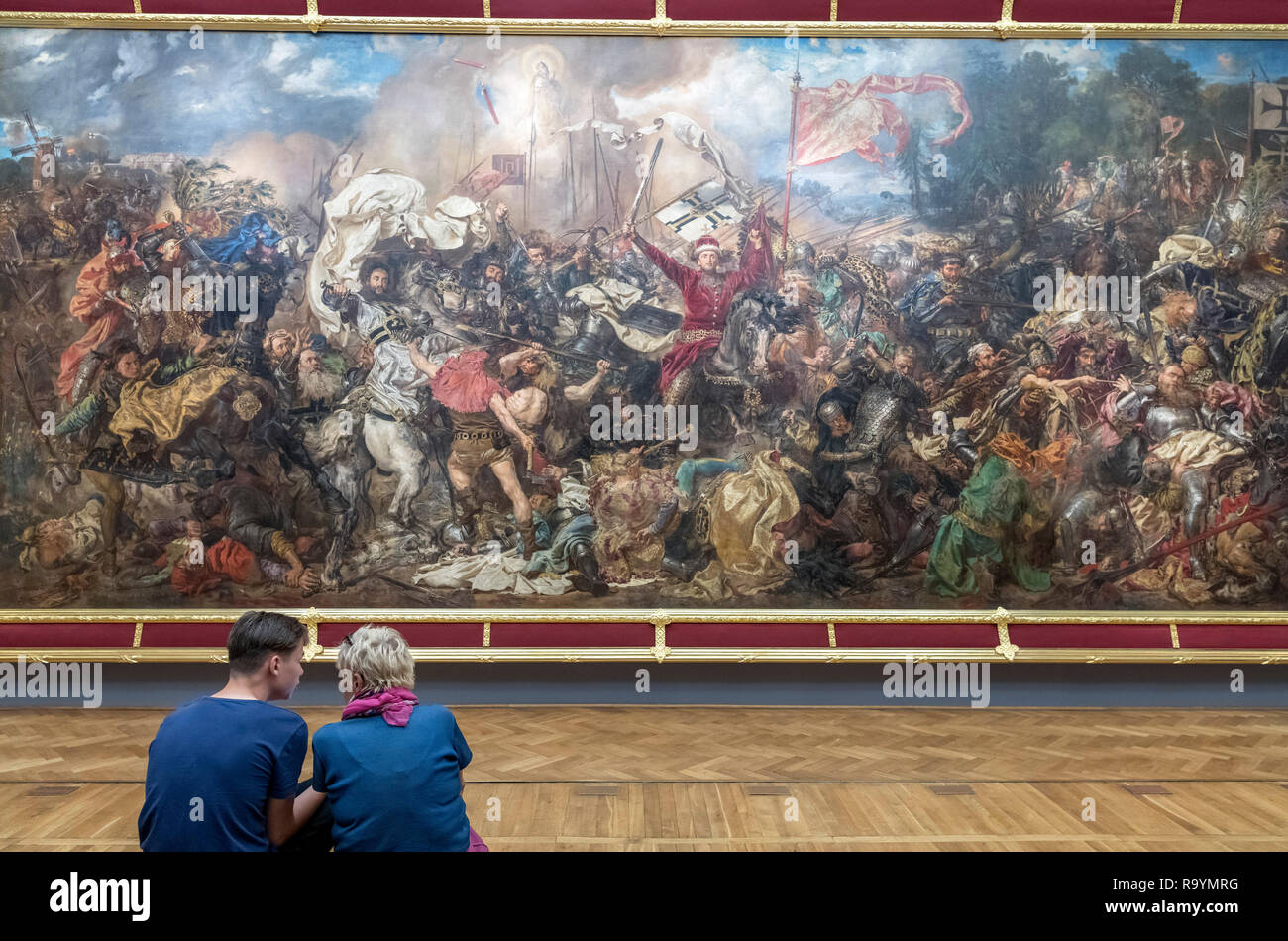 Visitors in the National Museum (Muzeum Narodowe w Warszawie) in front of the Battle of Grunwald by Jan Matejko, Warsaw, Poland Stock Photo