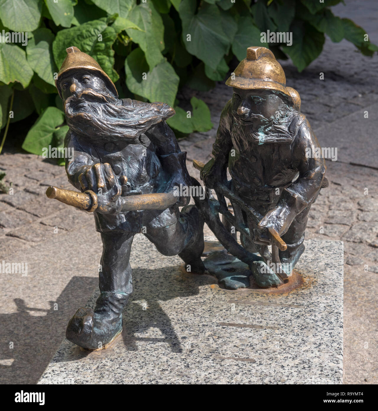 Miniature statues of Firemen, two of Wroclaw's dwarfs (Krasnale, Krasnoludki), Wroclaw, Silesia, Poland Stock Photo