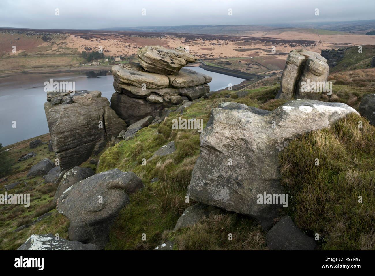 Yorkshire Water's Widdop Reservoir near Hebden Bridge seen from the rock outcrop on the moor above, with a view of the dam wall. . Stock Photo