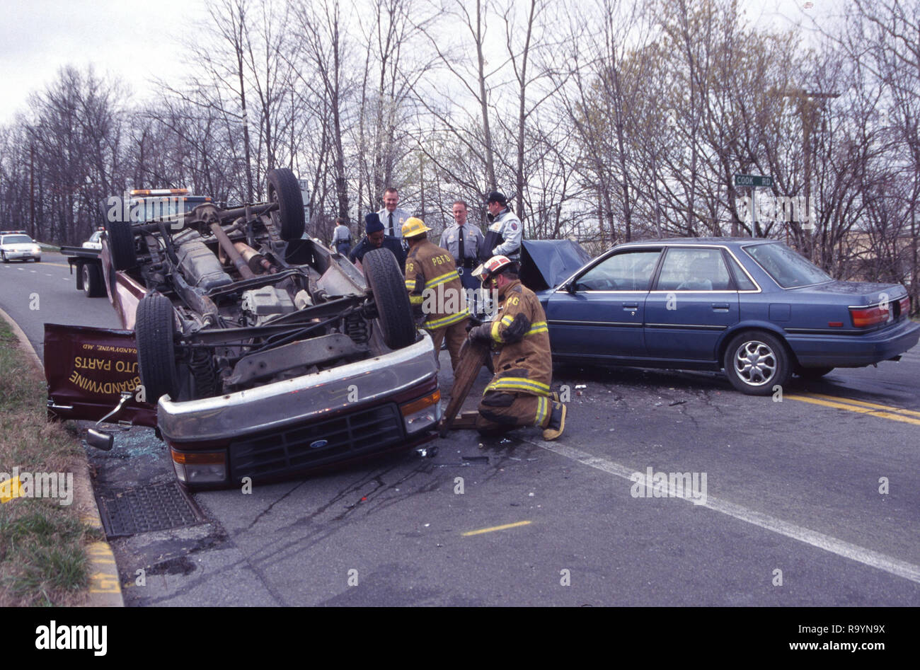Auto accident with a truck flipped over Stock Photo