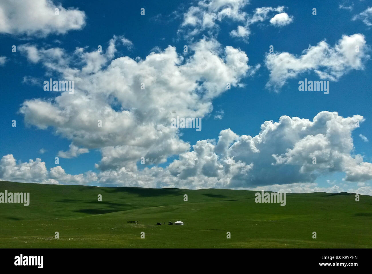 Lonely Mongolian Yurt in wide open steppe countryside under scenic blue sky, Bulgan, Mongolia Stock Photo