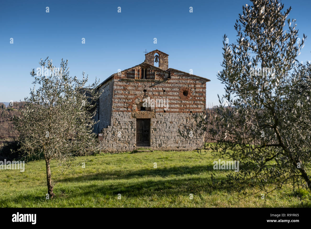 Santi Ippolito and Cassiano romanic church is a place of Catholic worship located in the locality of Coneo, in the municipality of Colle di Val d'Elsa Stock Photo