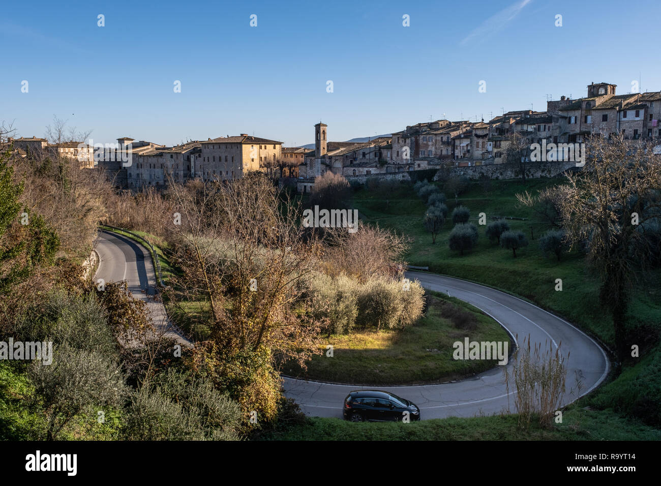 Panoramic view and  provincial road with the medieval towers of the village of Colle di Val d'Elsa, Siena, Tuscany Stock Photo