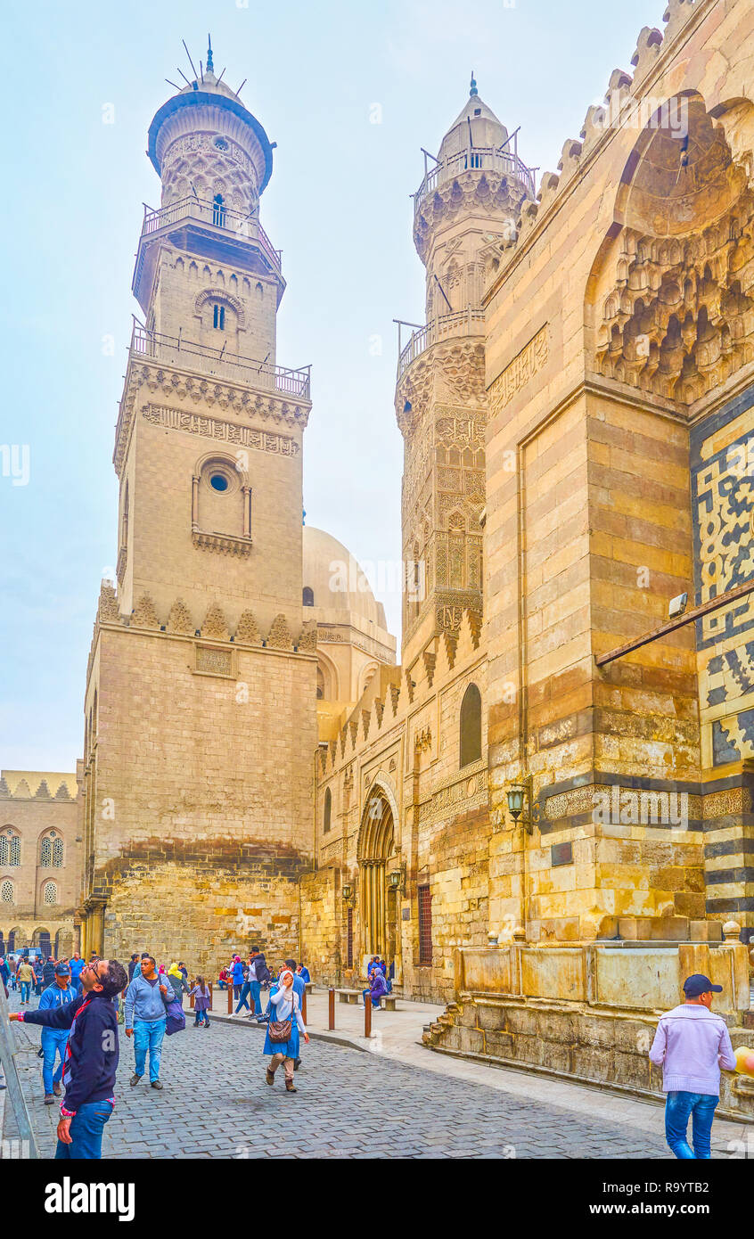 CAIRO, EGYPT - DECEMBER 20, 2017: The beautiful carved minarets of Qalawun complex are the fine example of architecture of medieval Cairo, on December Stock Photo