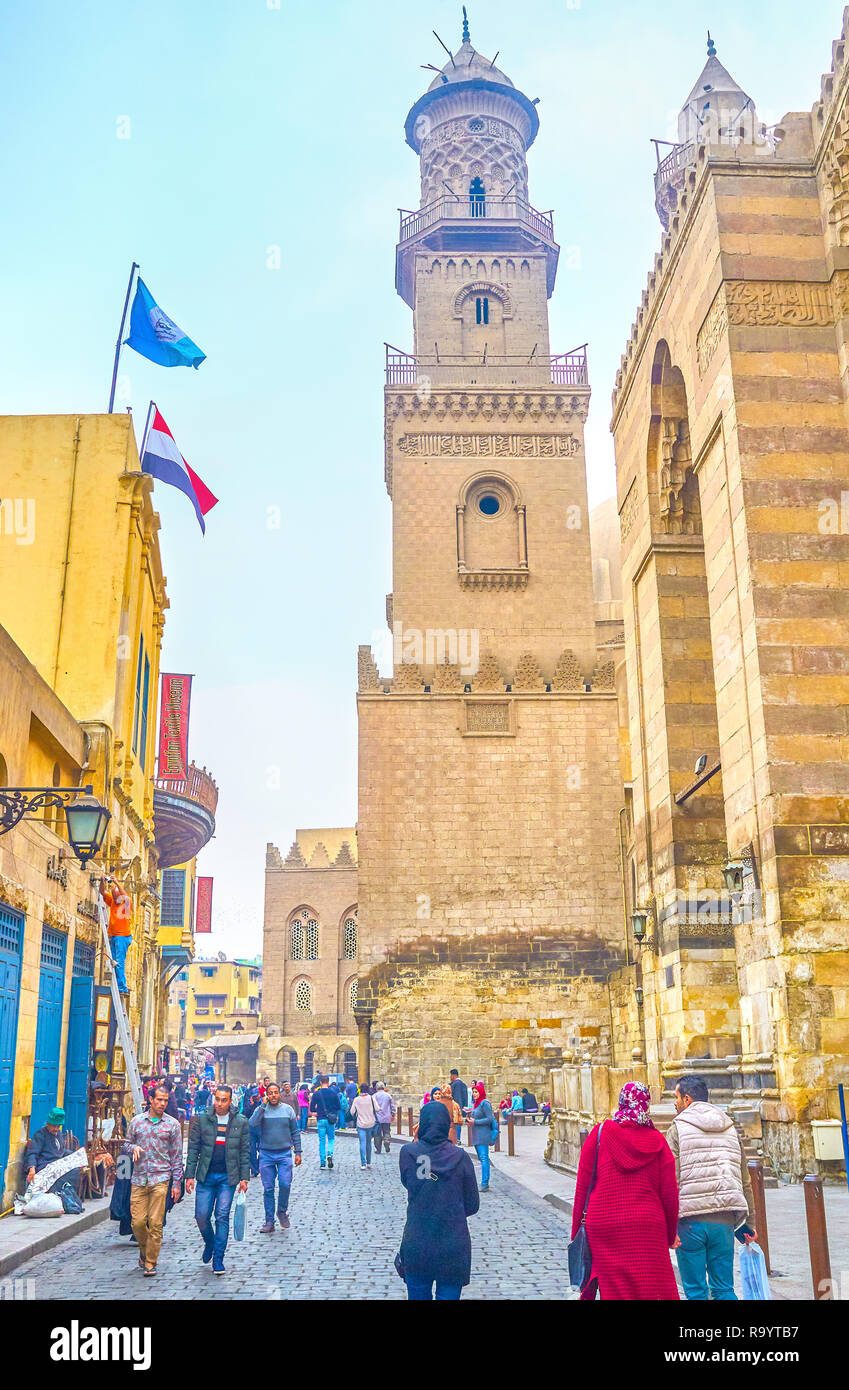 CAIRO, EGYPT - DECEMBER 20, 2017: The stately historical Qalawun Complex in Al-Muizz street attracts tourists and other medieval architecture lovers,  Stock Photo