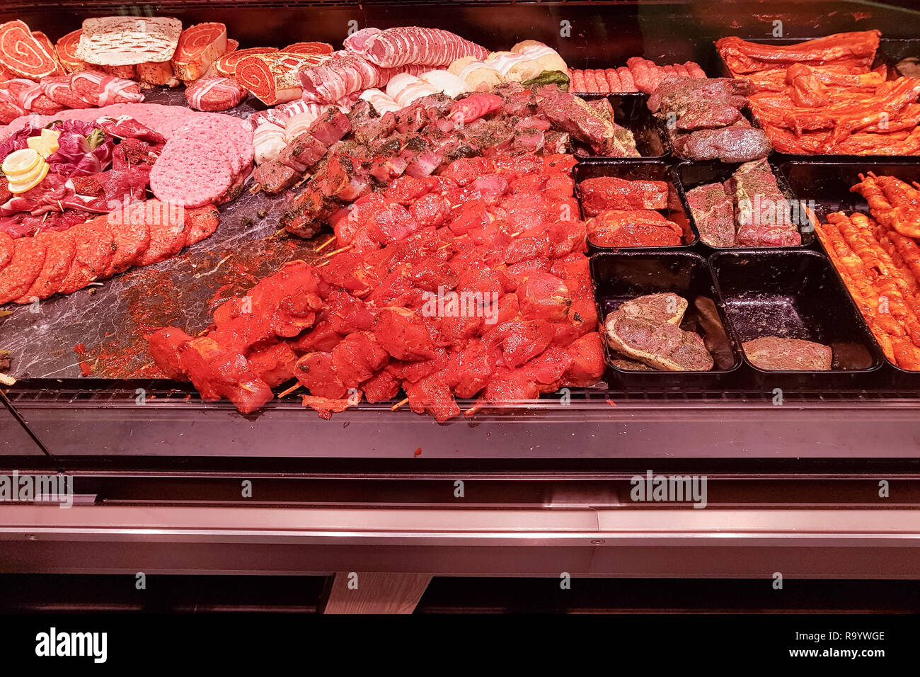 Meat department with typical german raw meat inside a supermarket. Pork