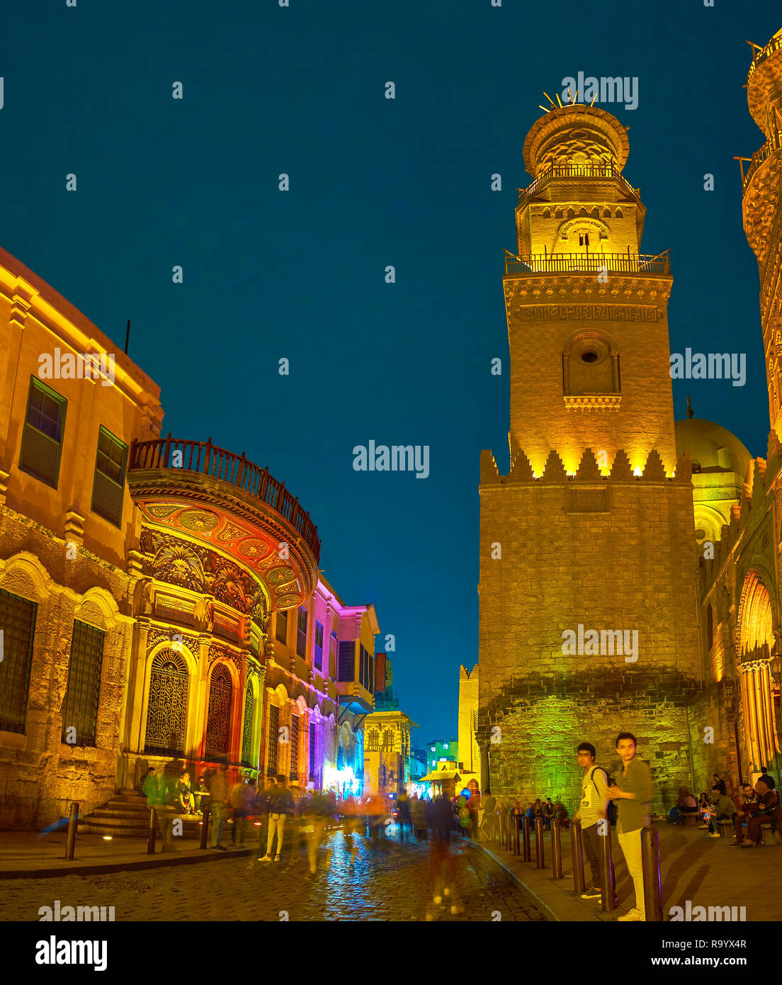 CAIRO, EGYPT - DECEMBER 20, 2017: The evening walk along popular Al-Muizz street and enjoy the bright illumination of medieval landmarks, on December  Stock Photo