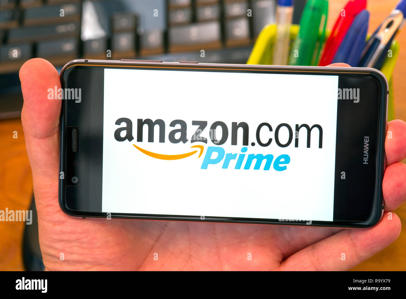 Piatra Neamt Romania July 30 18 Hand Holds A Mobile Phone With Amazon Prime Logo On The Screen Office Background Stock Photo Alamy