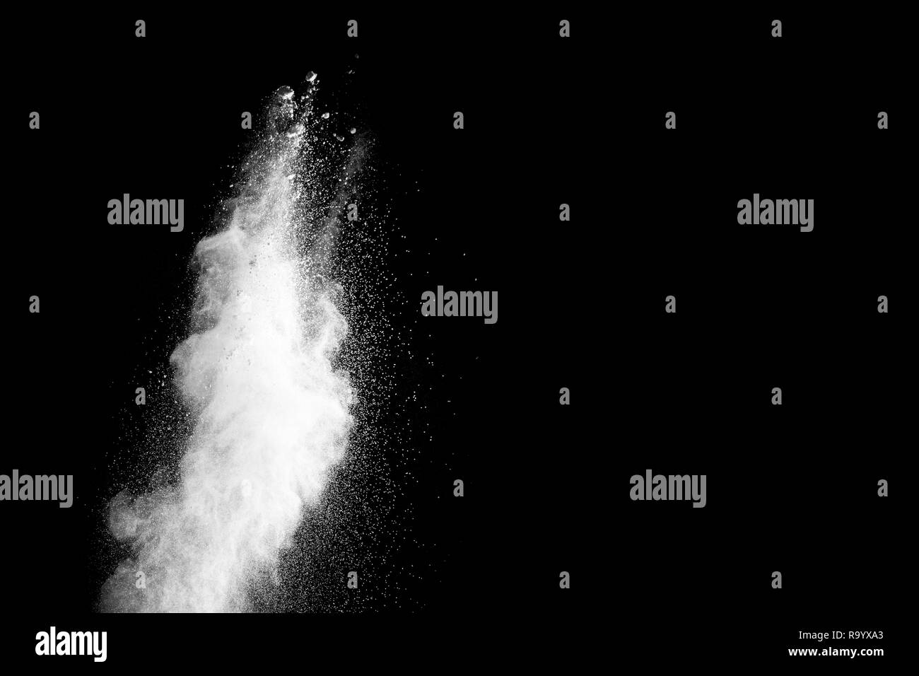 Launched white powder splash on black background. Stock Photo