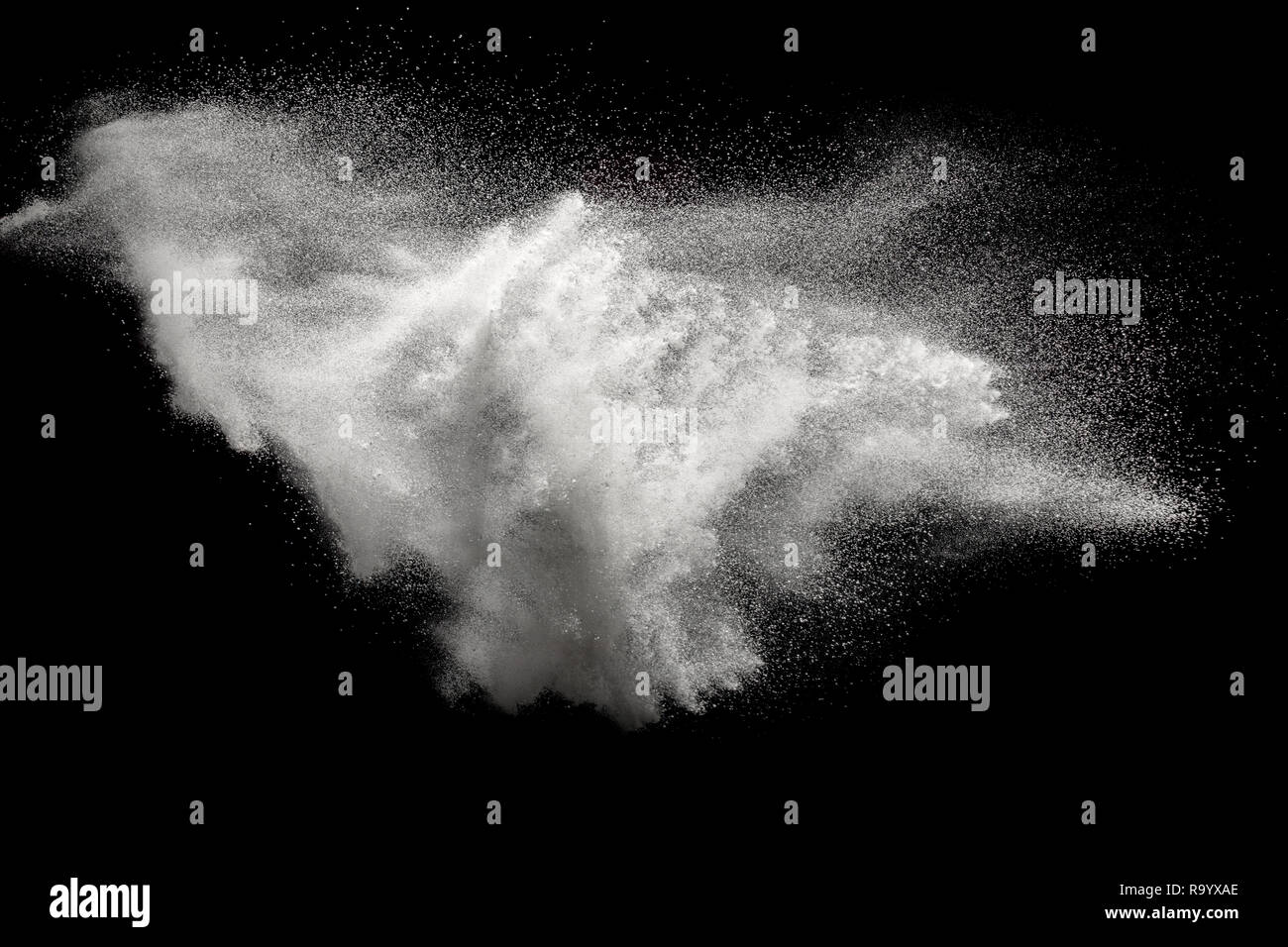 Bizarre forms of white powder explosion on white background.Launched ...