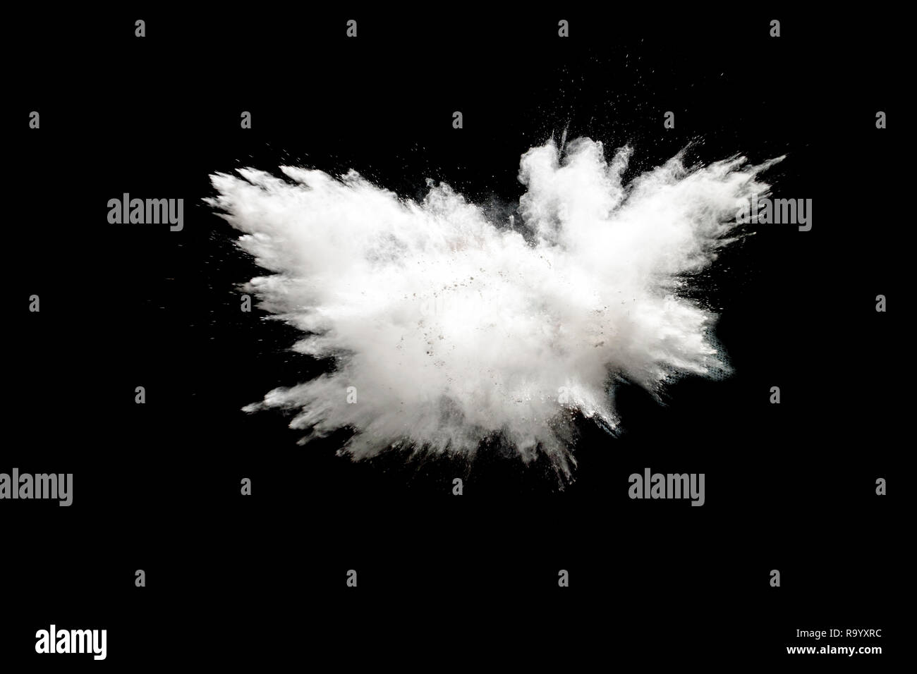 Bizarre forms of white powder explosion on white background.Launched ...