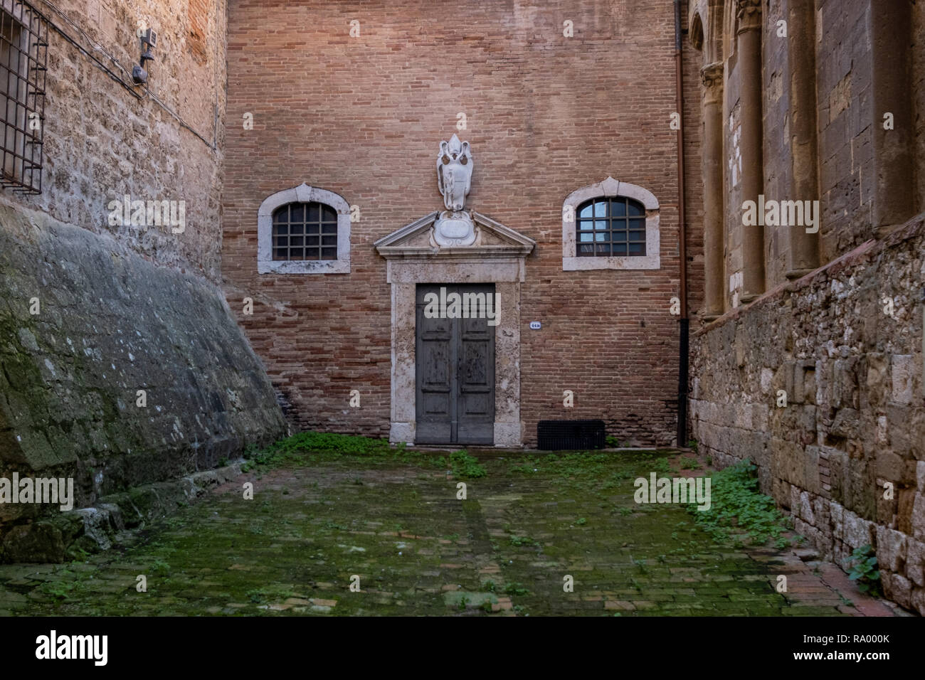 The internal courtyard of the Cathedral in the oldest part of the town of Colle Val d'Elsa, Siena, Tuscany Stock Photo
