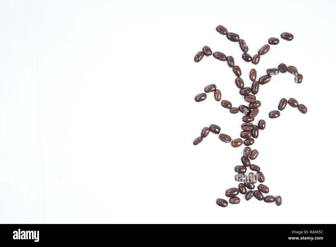 Roasted coffee beans close-up with white background Stock Photo - Alamy