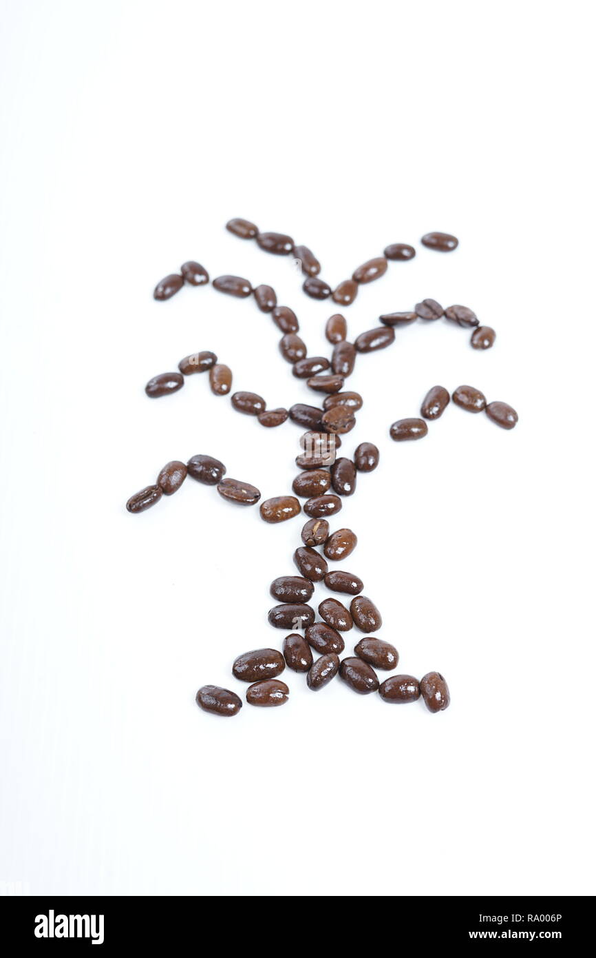 Roasted coffee beans close-up with white background Stock Photo - Alamy