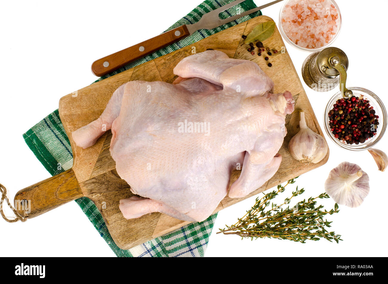 Raw chicken and vegetables on a cutting board Stock Photo - Alamy