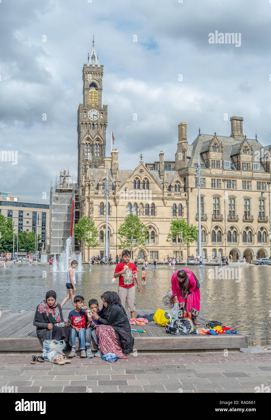 Street photograph of Asian locals in the centre of Bradford West Yorkshire UK Stock Photo