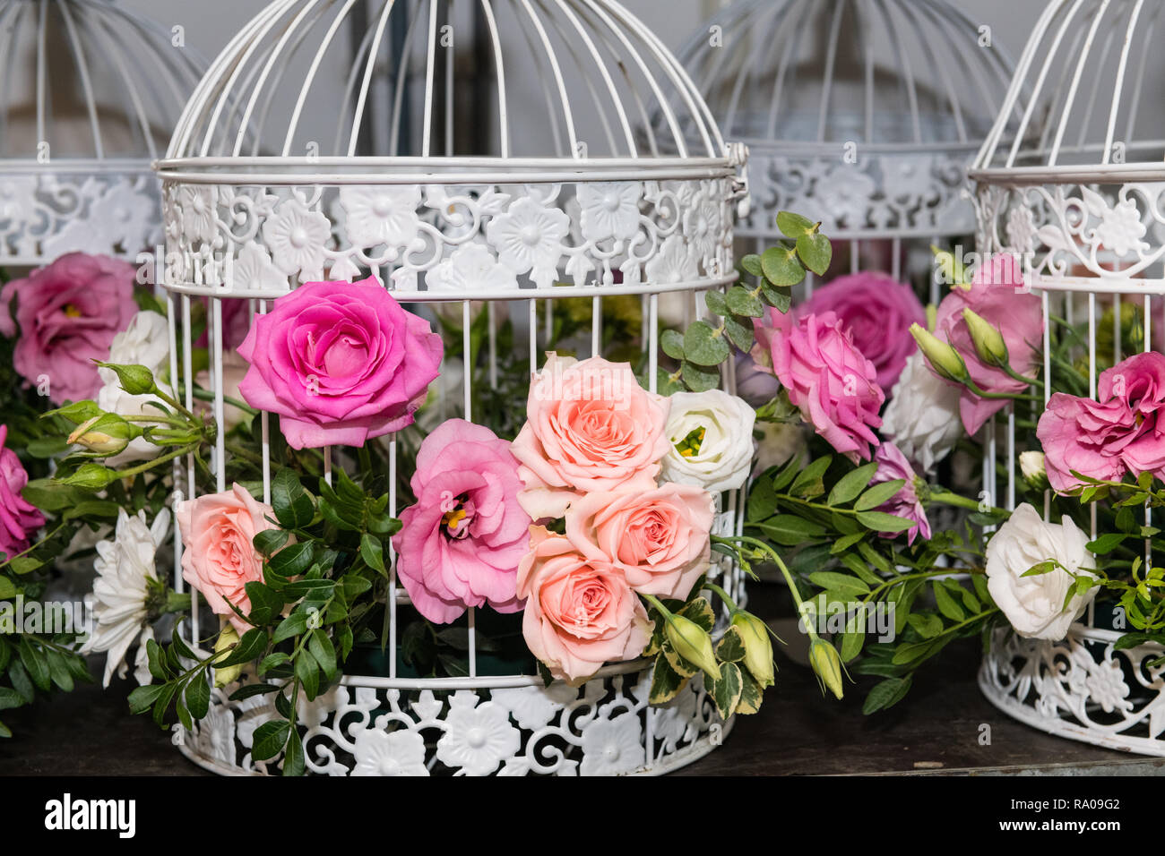 Various Bridal Flower Heads In Vintage Ornate Bird Cage As Bloom