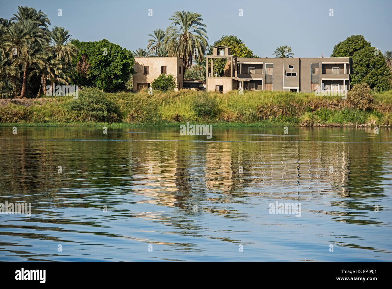 View across large wide river Nile in Egypt at Edfu through rural