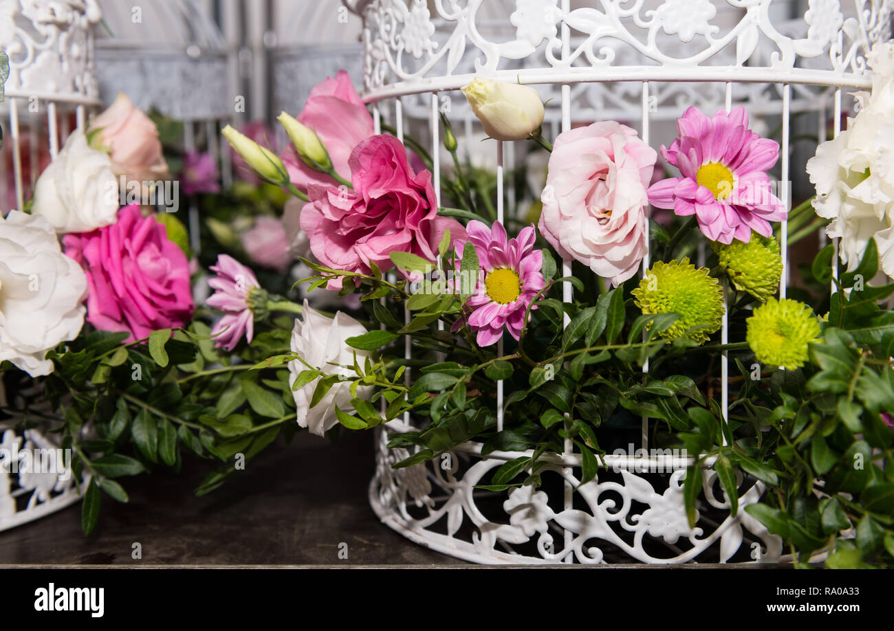 Various Bridal Flower Heads In Vintage Ornate Bird Cage As Bloom