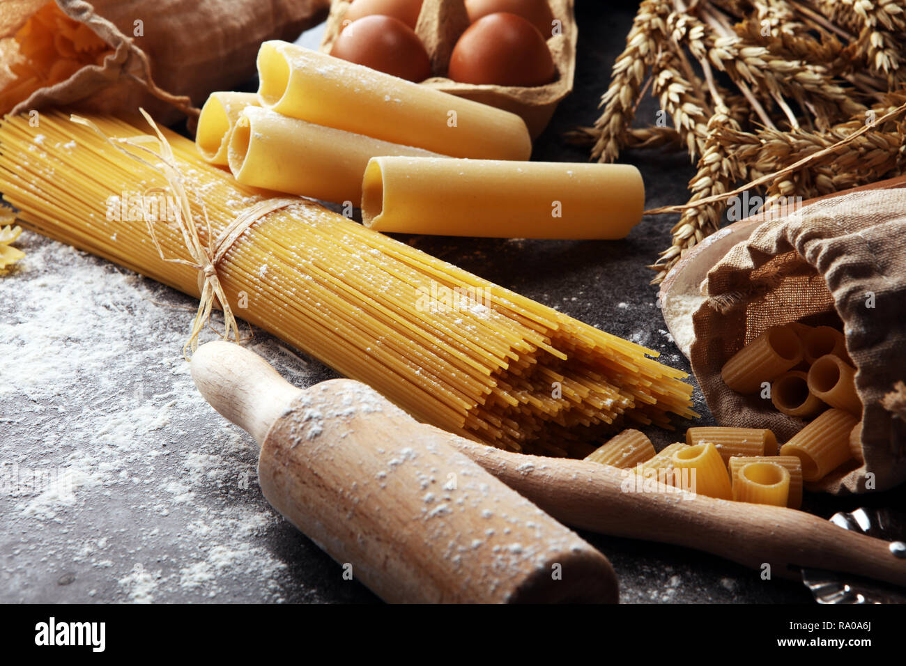 Picture of pasta. Fresh homemade pasta with pasta ingredients on the rustic table ...