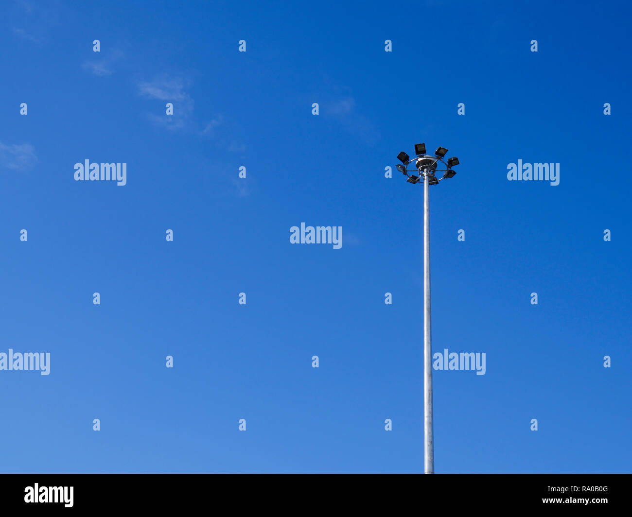 The light on the steel pole with blue sky background. Stock Photo