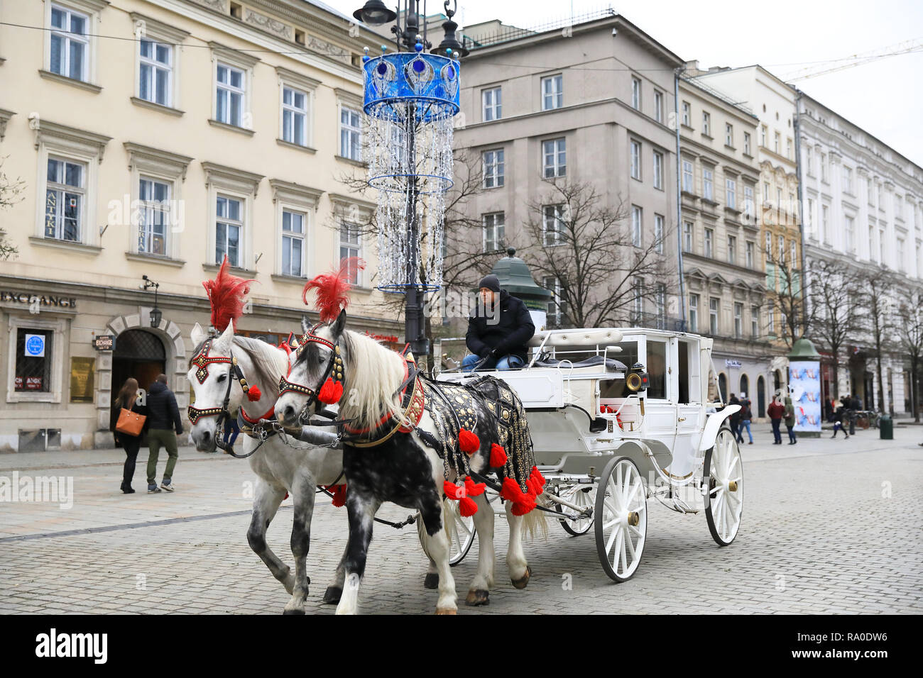 One of the pretty horse & carriages on Main Market Square, at Christmas time, in Krakow, Poland Stock Photo