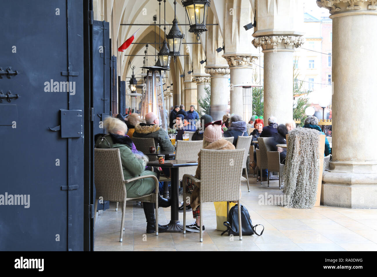 Restaurants at Christmas time, in the arcades of the Cloth Hall, on the Main Market Square, in Krakow, Poland Stock Photo