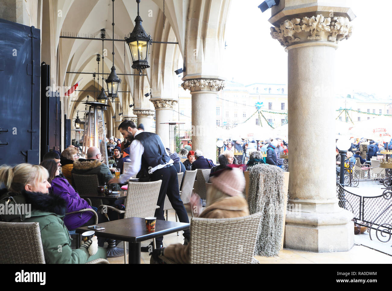 Restaurants at Christmas time, in the arcades of the Cloth Hall, on the Main Market Square, in Krakow, Poland Stock Photo