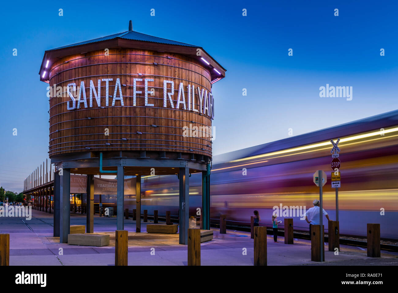 Santa Fe Railyard Train Depot Complex and Rail Runner Express train at dusk, Santa Fe New Mexico, USA. Stock Photo