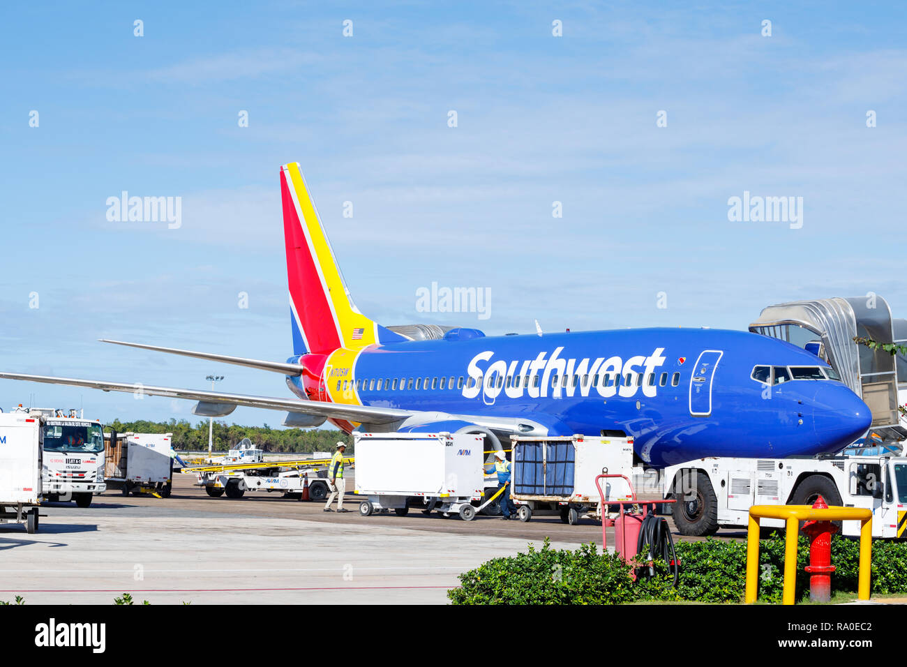 Punta Cana, Dominican Republic - December 24, 2018: A Southwest Passenger Jet at the Punta Cana International Airport on tarmac awaiting cargo Stock Photo