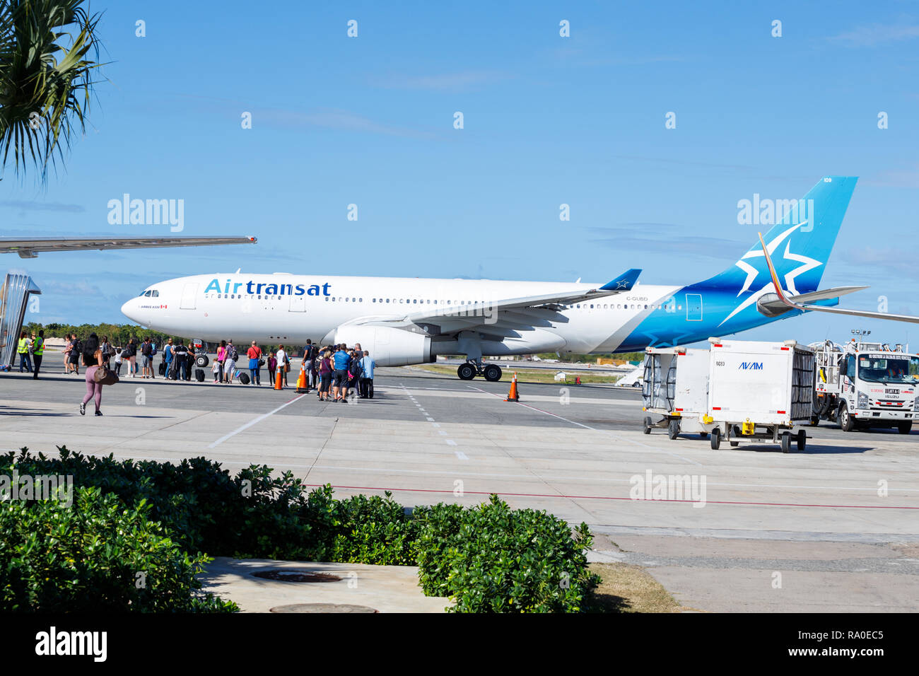 Punta Cana, Dominican Republic - December 24, 2018: An Air Transat Passenger Jet at the Punta Cana International Airport on tarmac awaiting cargo Stock Photo