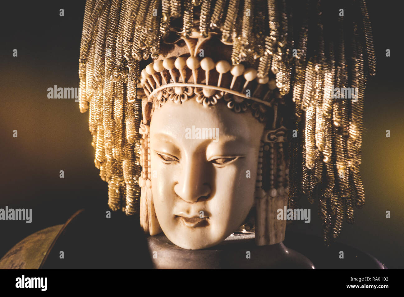 female buddha indian statue head portrait background Stock Photo