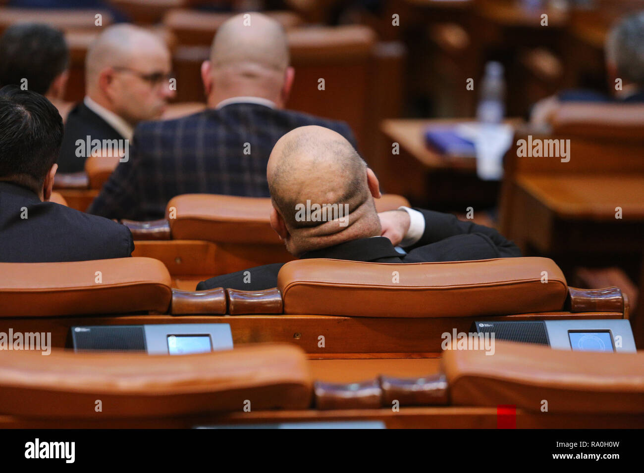 BUCHAREST, ROMANIA - December 12, 2018: Romanian member of Parliament is taking part at a meeting in the Chamber of Deputies Stock Photo